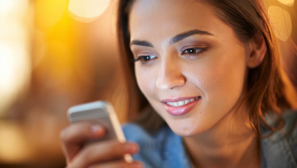 woman sending a text message with calm confidence, The hero instinct 12 word text